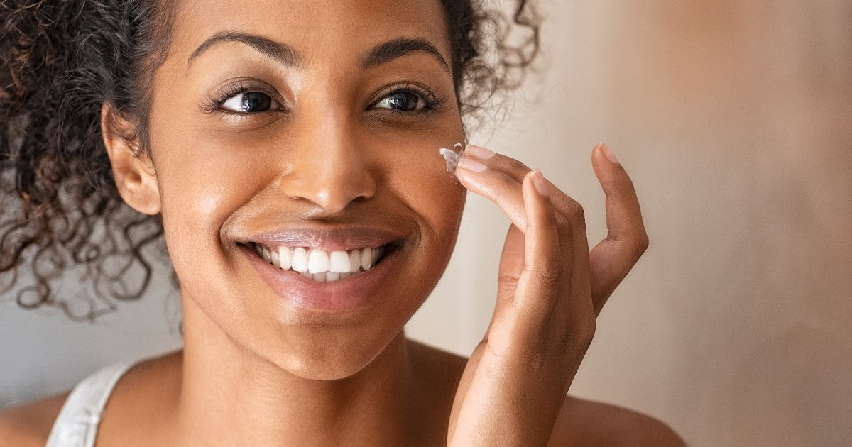woman happy with skincare ritual